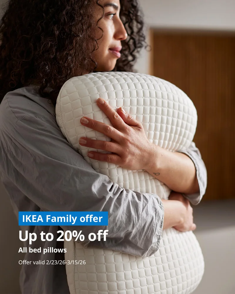 Woman hugging IKEA bed pillow
