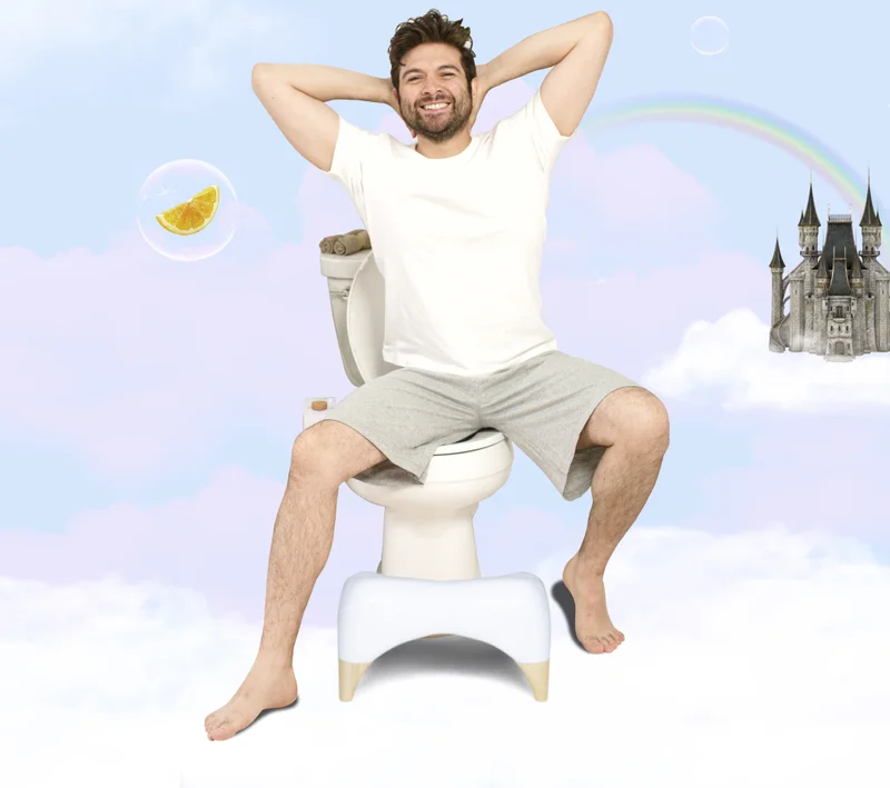 MAN SITTING ON TOILET