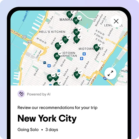 Image Description: A phone screen shows a map with a prompt to review our recommendations for your trip and a headline that reads: New York City. Underneath, it reads: Going solo, 3 days.