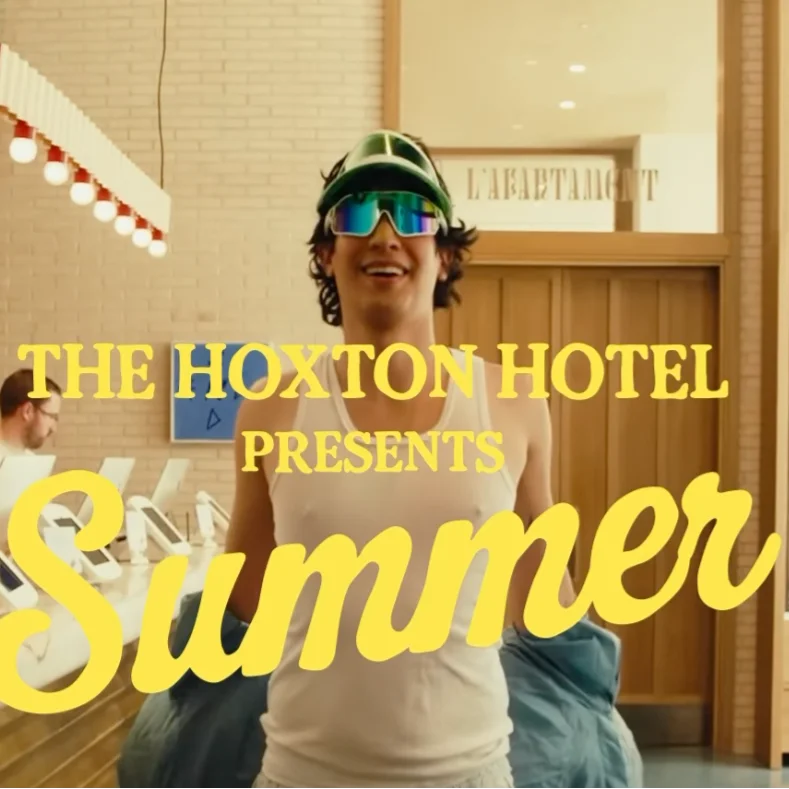 Person in sunglasses, hotel lobby