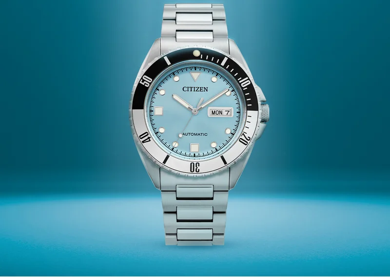 Our latest timepiece, the Sport Automatic, featuring a striking light blue dial with a sunray finish. A a bold two-tone 60-minute bezel, and a silver-tone stainless steel bracelet