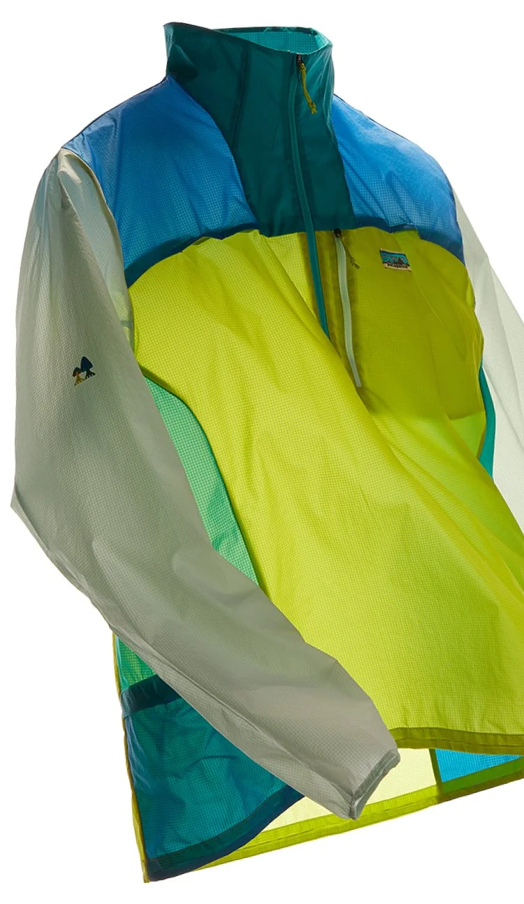 The Houdini Stash 1/2-Zip Pullover stuffing into its own pocket.