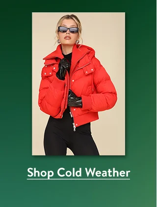 A woman wearing a short red puffy coat.