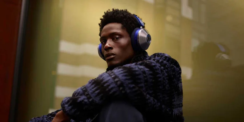 A man wearing Dyson Zone headphones