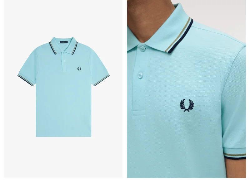 A close up of a M3600 Fred Perry Shirt in Mint Blue / Olive Mint / French Navy