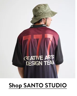 A man wearing A Milano team jersey from SANTO STUDIO.