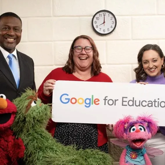 Three people holding a sign that says 'Google for Education'