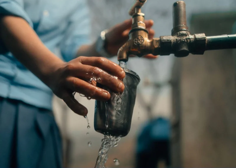 Graphic of someone filling a cup of water.