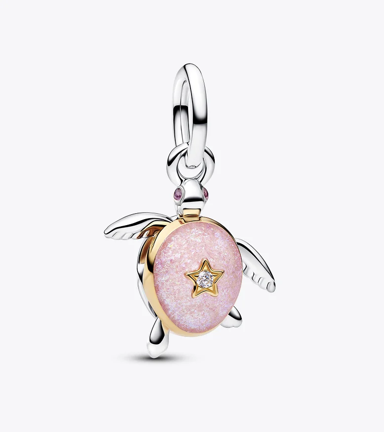 A turtle charm with a pink enamel shell and lab-grown diamond