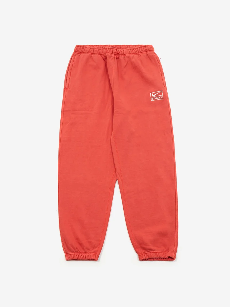 Image of Nike x Stussy Pigment Dye Fleece Pant - Habanero Red/Natural