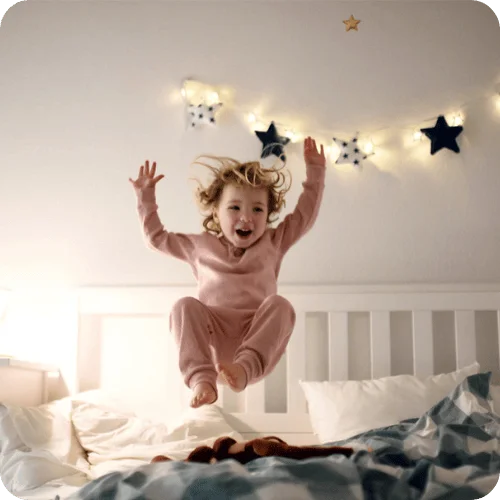 a toddler jumping on the bed a toddler jumping on the bed