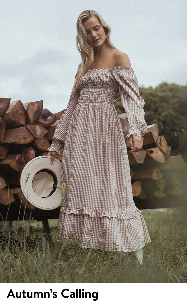 A woman wearing a gingham dress.