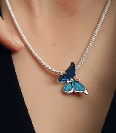 Butterfly sterling silver charm with clear cubic zirconia, black, teal and purple enamel