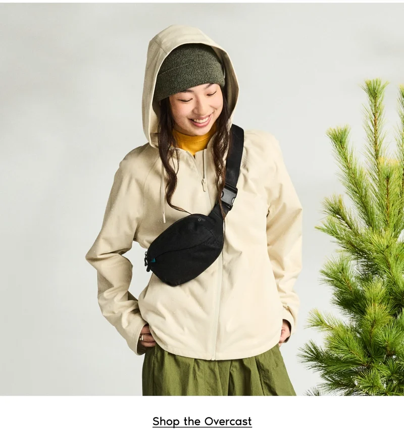 Graphic of a girl wearing the Overcast Jacket and Shoreline Belt Bag.