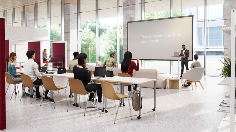 Multipurpose presentation space with podium and amphitheater style seating and touchdown booths for focus work.