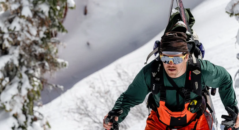 Anon Winderness Sunglasses in yellow on a female model mountain biking in the woods