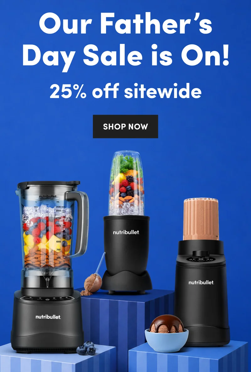 Three black nutribullet blenders filled with fruit, nuts, and ice on blue pedestals next to a bowl of chocolate ice cream.