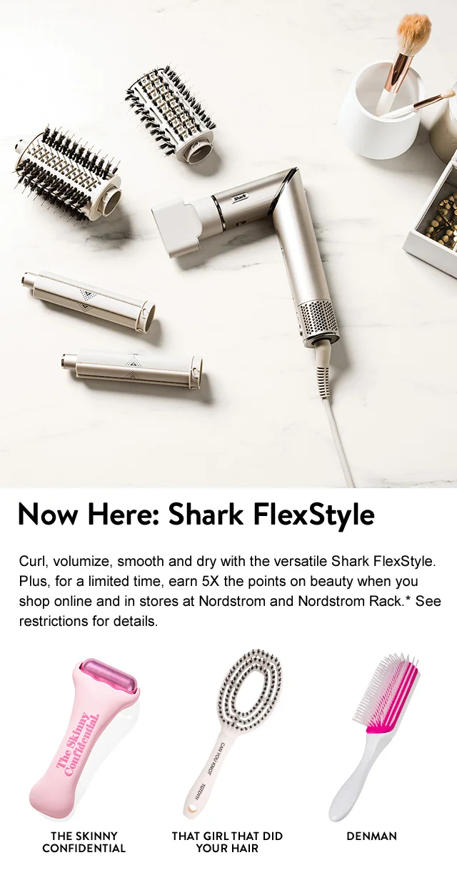 Shark hair tool with attachments. The Skinny Confidential ice roller. That Girl That Did Your Hair hairbrush. White and pink Denman hairbrush.