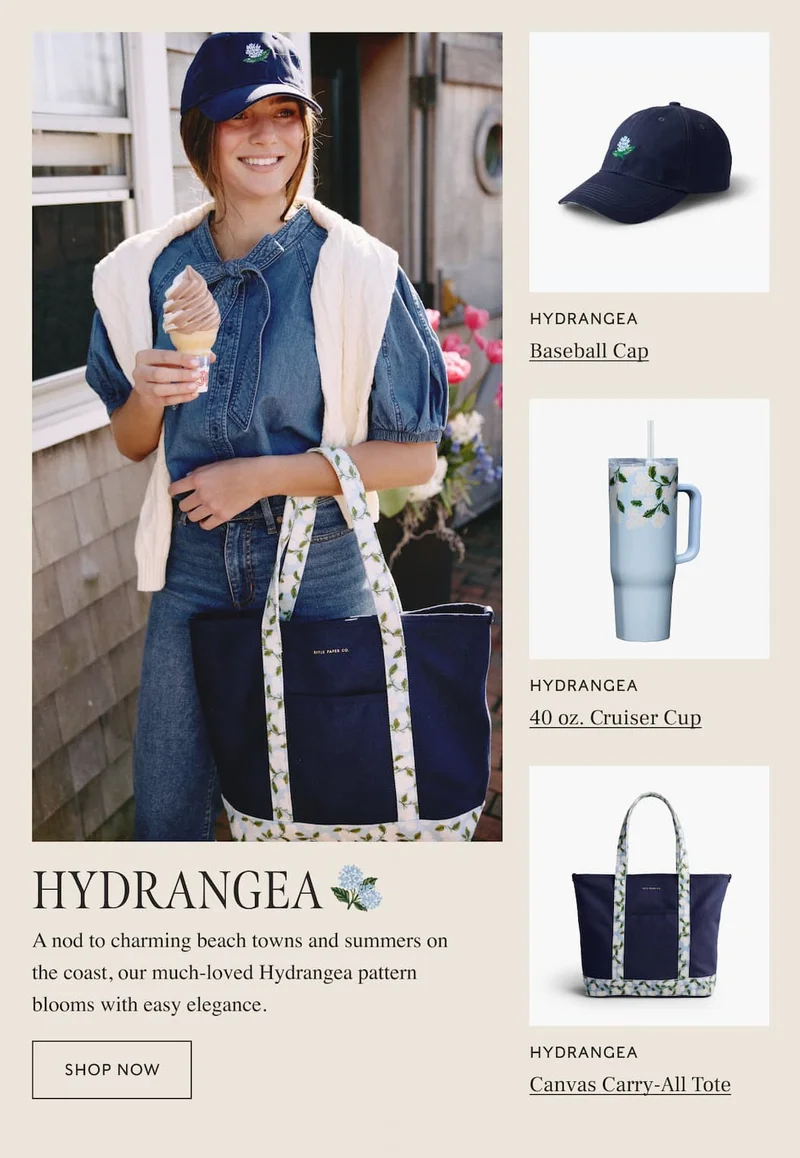 Women holding ice cream and wearing Hydrangea-themed accessories, with featured items: baseball cap, creuiser cup, and canvas tote. "Shop Now" button included.