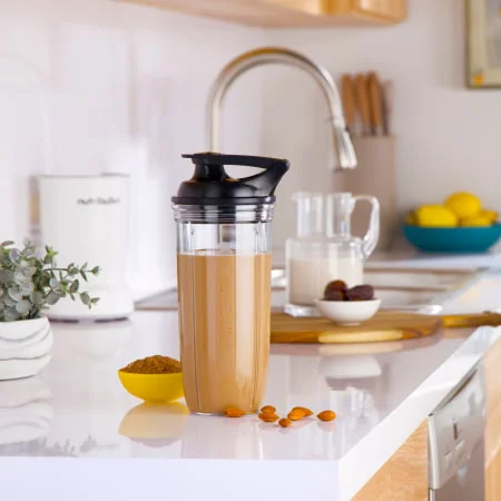 Thick chocolate smoothie served in a nutribullet cup on a kitchen counter, showing a rich and high-protein recipe.