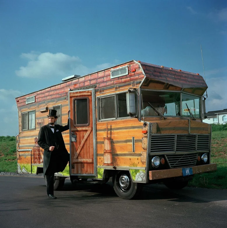Abraham Lincoln began life in a log cabin and ended up in the White House. His story inspired historical presenter Gerald Bestrom, who painted his motor home to resemble a log cabin and traveled across the Midwest performing in schools and nursing homes until his death in 2012.