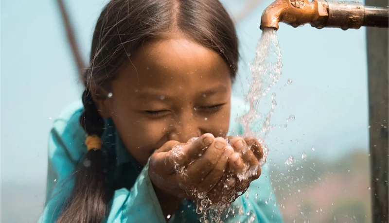 Graphic of a girl drinking clean water.