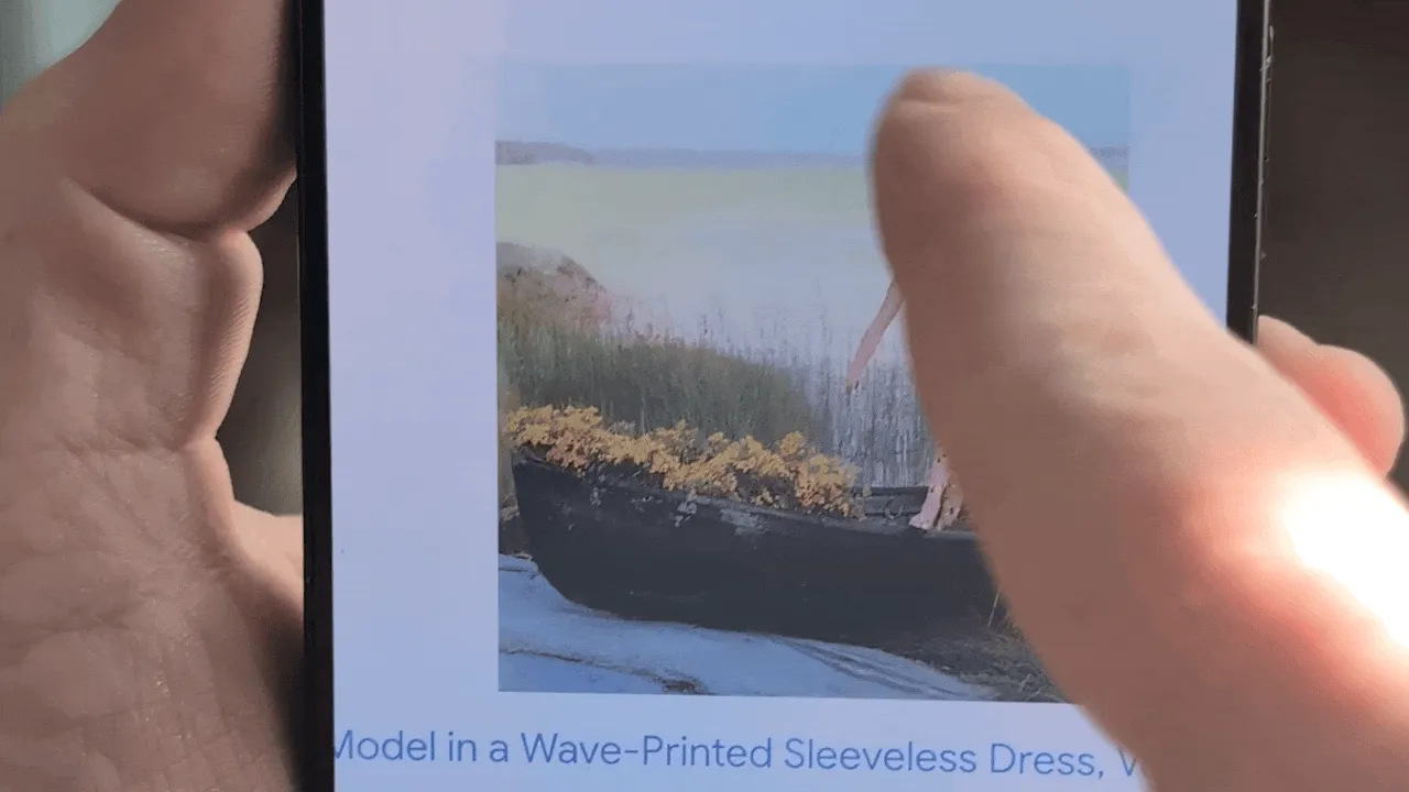 A close-up of a smartphone screen displaying the Google Lens interface. The lens is focused on a fashion image of a model in a patterned dress, with the search result 'Model in a Wave-Printed Sleeveless Dress, Vogue' displayed below. Then, a finger draws a circle around the woman.