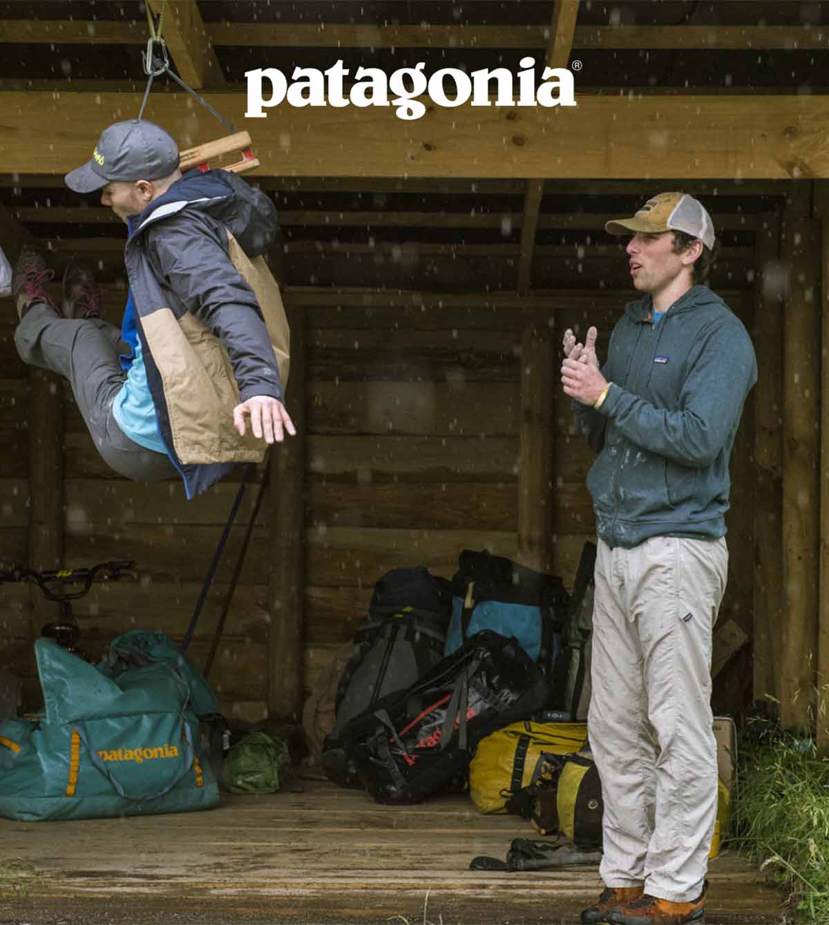 Patagonia. Two people training on a hangboard in the rain.