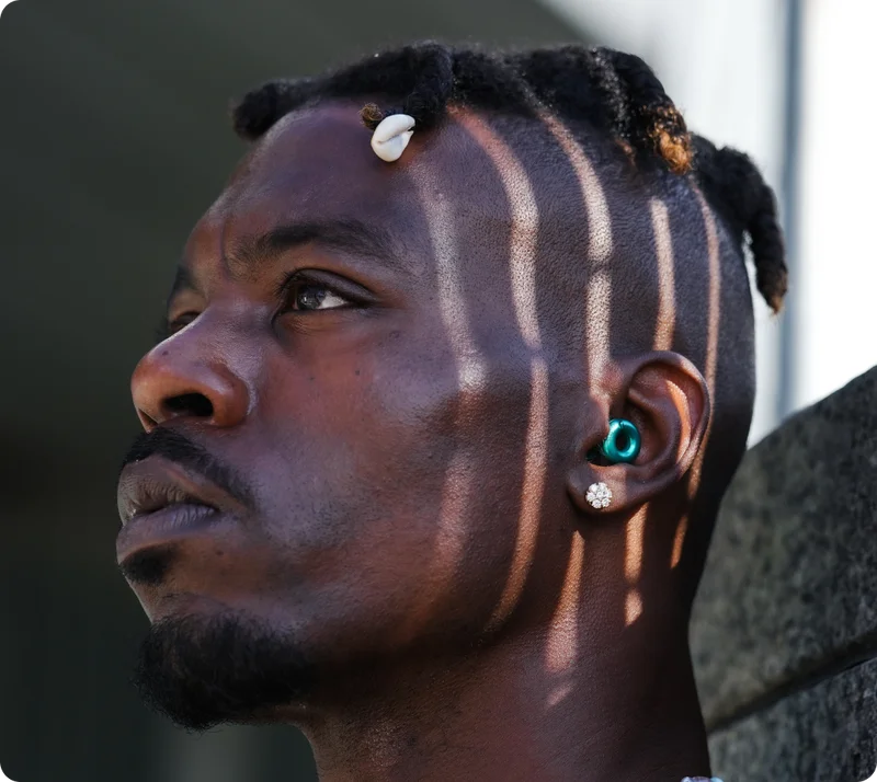 Man in the street wearing Loop Switch in Emerald