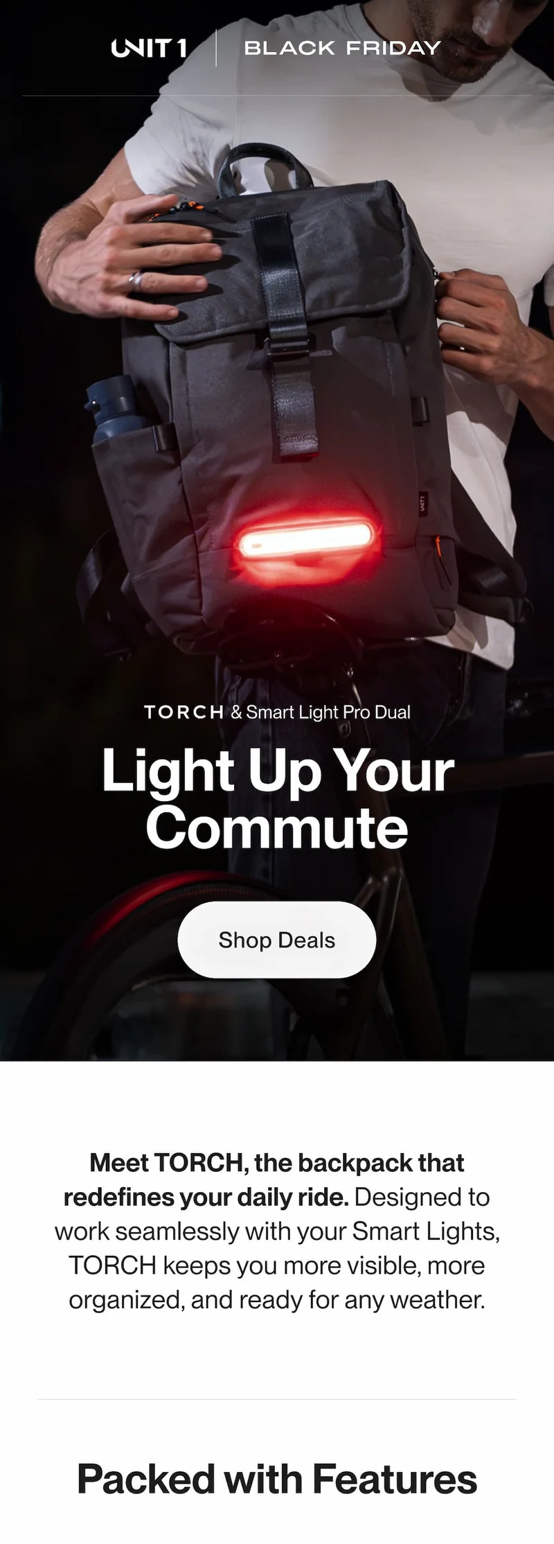 Cyclist attaching the TORCH backpack with the Smart Light Pro Dual glowing red during a nighttime ride.
