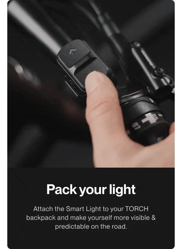 Smart Light attached to the TORCH backpack glowing red to increase road visibility.