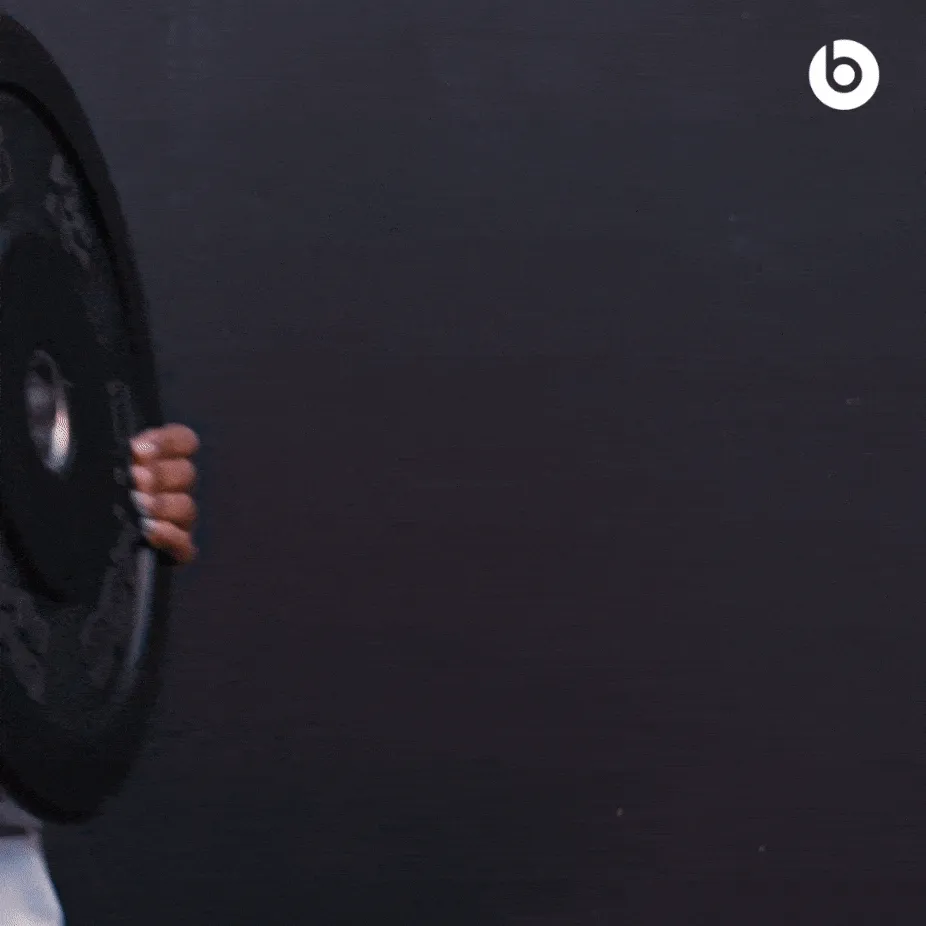 Person working out at the gym while wearing Beats Solo 4 in Slate Blue.