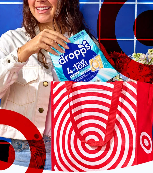Woman pulling Dropps 4-in-1 Plus Oxi Laundry Detergent out of a Target bag