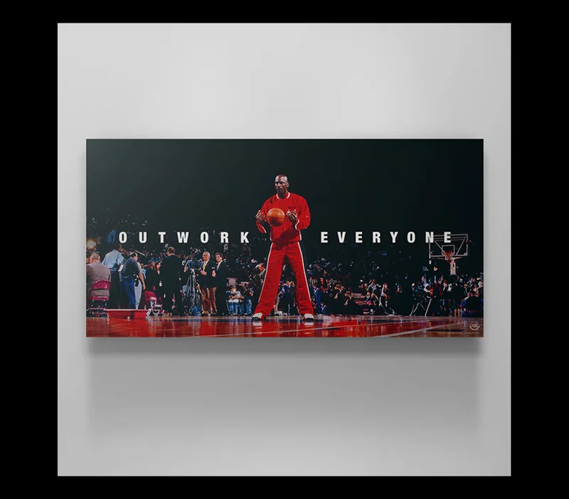 A Michael Jordan wall art canvas on a plain white wall A Michael Jordan wall art canvas on a plain white wall