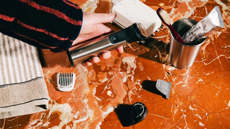 Image may contain: Brush, Device, Tool, Toothbrush, Cooking, Mashing Food, Adult, and Person best beard trimmer