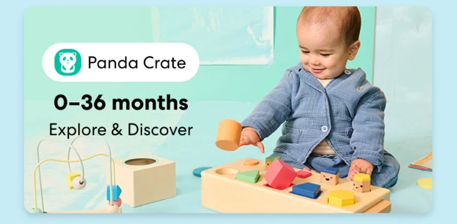Baby playing with a KiwiCo Panda Crate toy. Designed for ages 0–36 months to explore and discover.