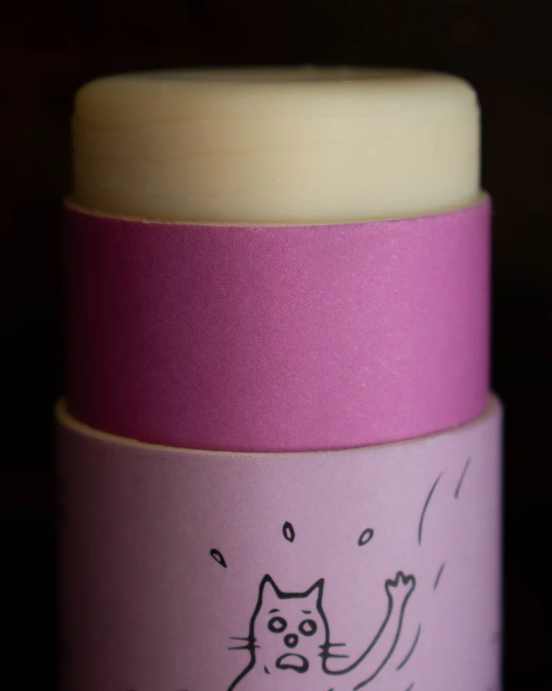 A purple stick with creamy white tube pushed up