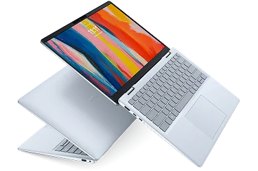 Two Dell 14 Plus laptop computers floating in midair.