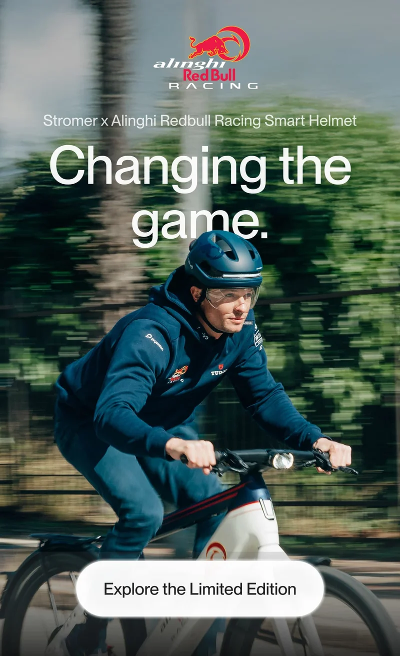 Cyclist wearing the Stromer x Alinghi Red Bull Racing Smart Helmet, showcasing its sleek design and cutting-edge safety features.