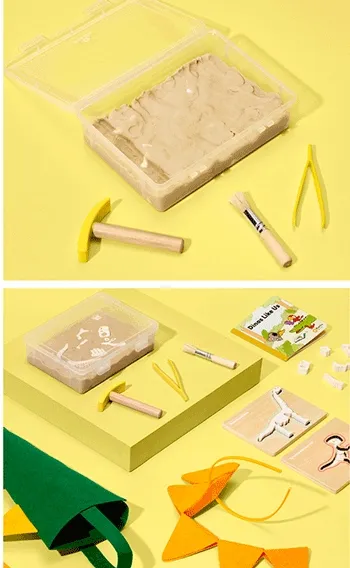 Dinosaur Dig from Koala Crate. Dig bones out of a bin of sensory sand, then put them together to make two dino skeletons.