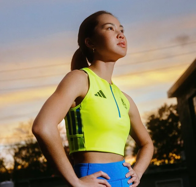 Woman in yellow and blue Boston Marathon Collection apparel