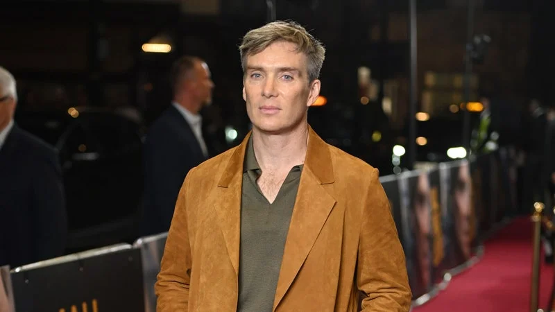 Image may contain: Cillian Murphy, Fashion, Adult, Person, Clothing, Footwear, Shoe, Coat, Standing, Blazer, and Jacket