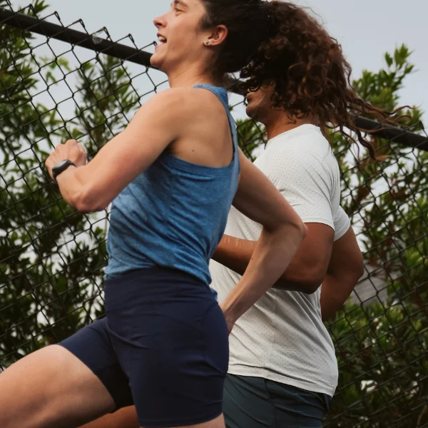 Two women running together