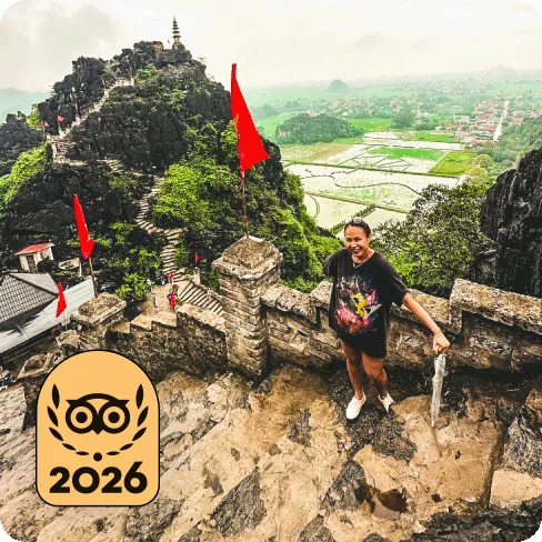Image Description: A person posing for a photo on the steps of an ancient building. A gold 2026 Travelers’ Choice Best of the Best badge is on the image.