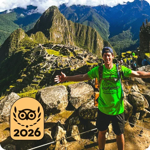 Image Description: A person posing for a photo on a trail overlooking an ancient city and mountains. A gold 2026 Travelers’ Choice Best of the Best badge is on the image.