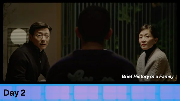 Film still of "Brief History of a Family" underneath says Day 2.