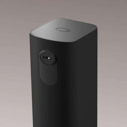 A removable Cowboy e-bike battery in a matte black finish with a minimalist design, including a key slot for secure locking and a subtle logo on top.