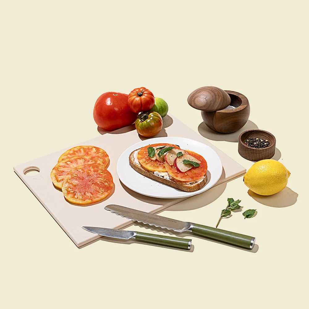 Material Knives and Cutting Board with Heirloom Tomatoes