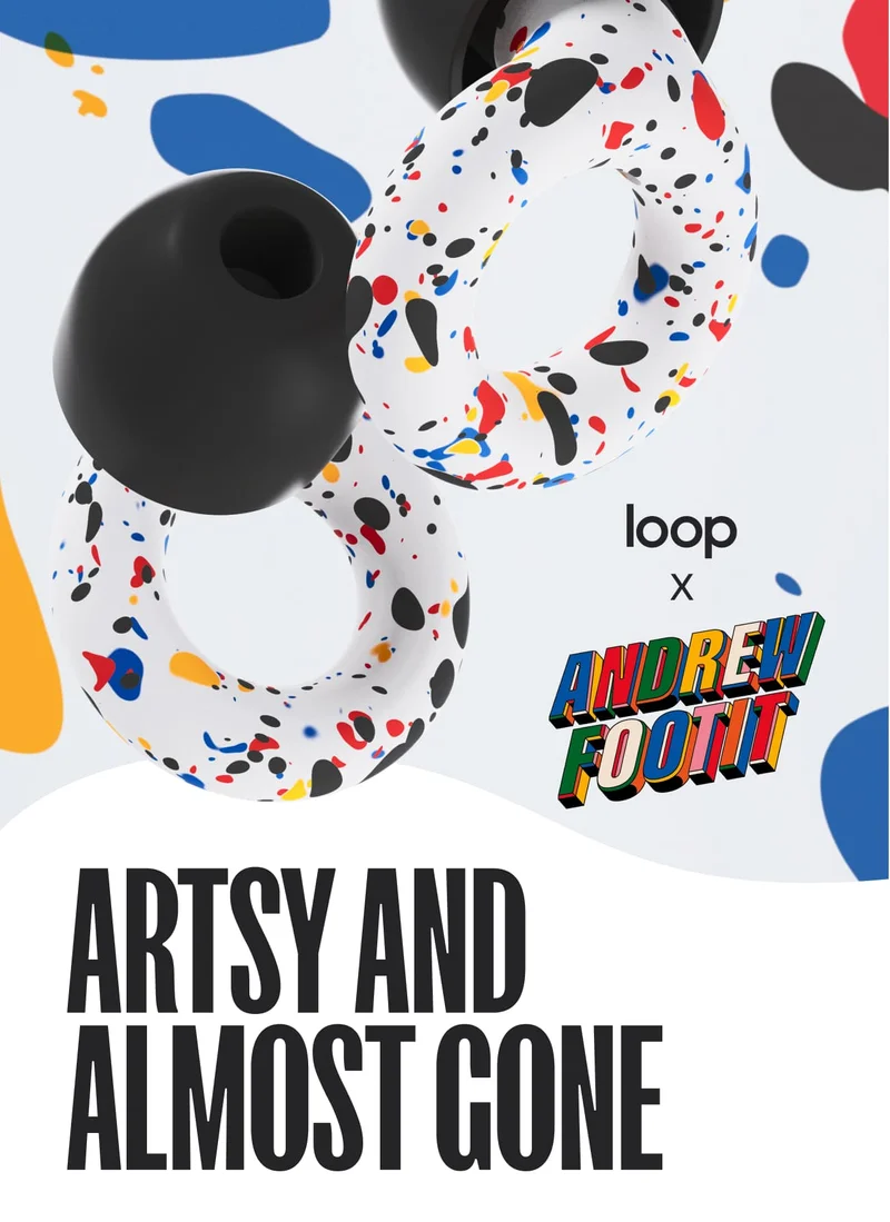 Close-up of the colorful new Experience earplugs from the Loop x Andrew Footit collection, featuring splashes of red, blue, yellow, orange and black atop a white base.