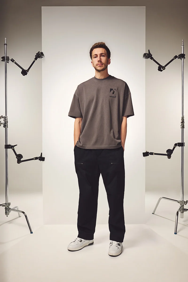 Image of Simon wearing the Initial Box T-shirt in Phantom Grey